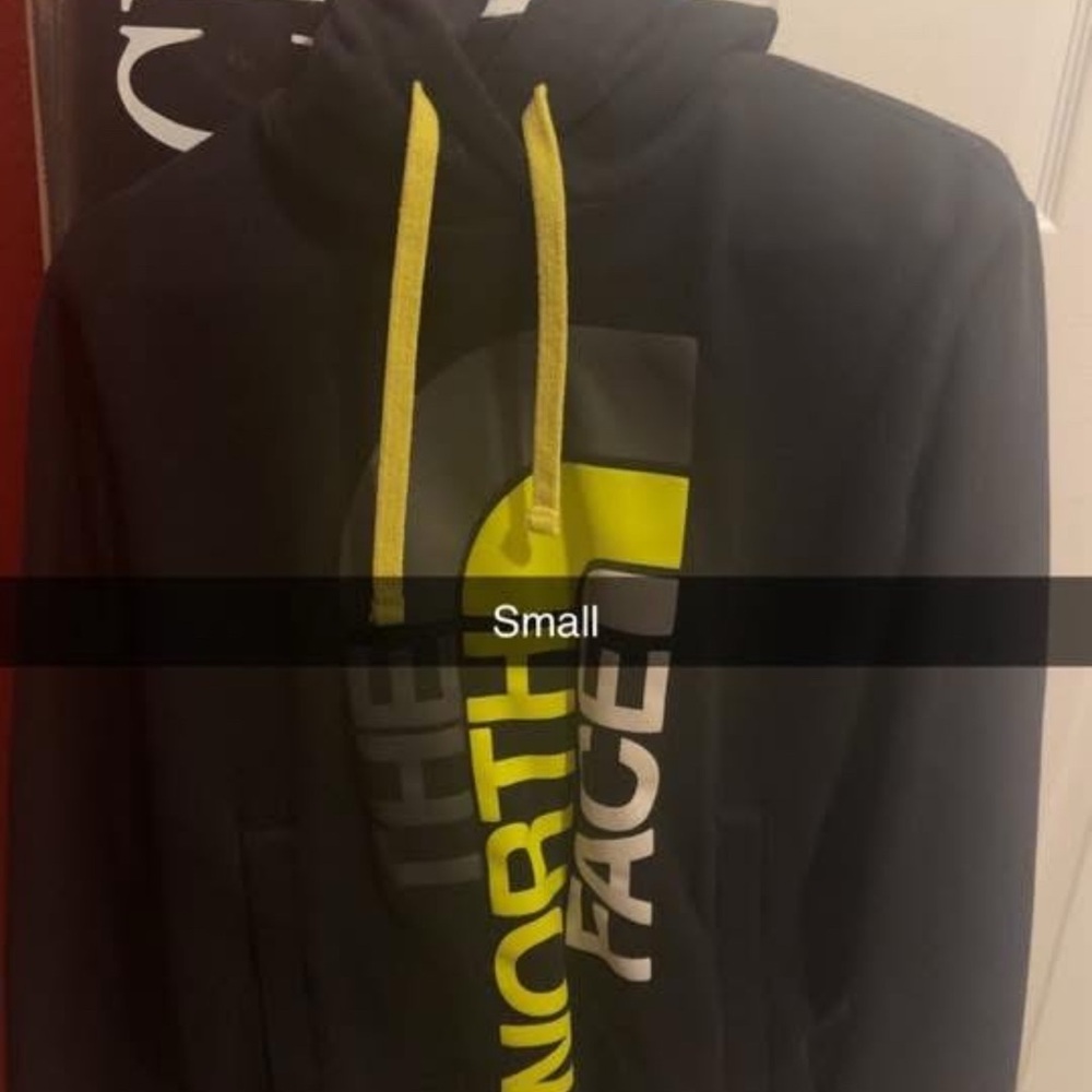 The North Face Black Hoodie with Vibrant Yellow Details